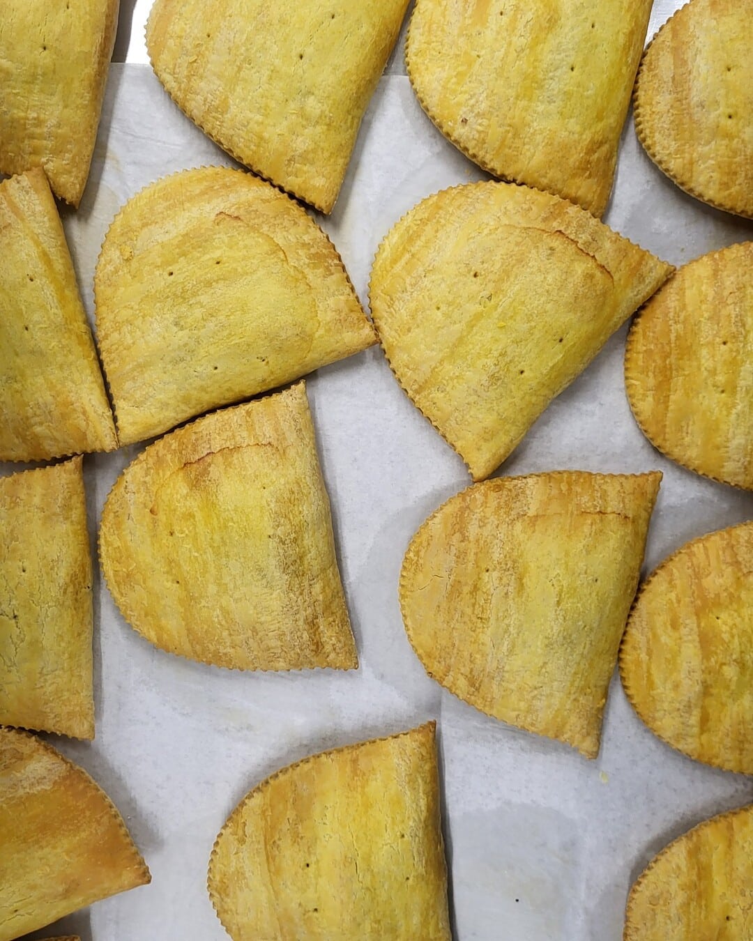 Overhead view of freshly baked Randy's patties arranged on a baking tray